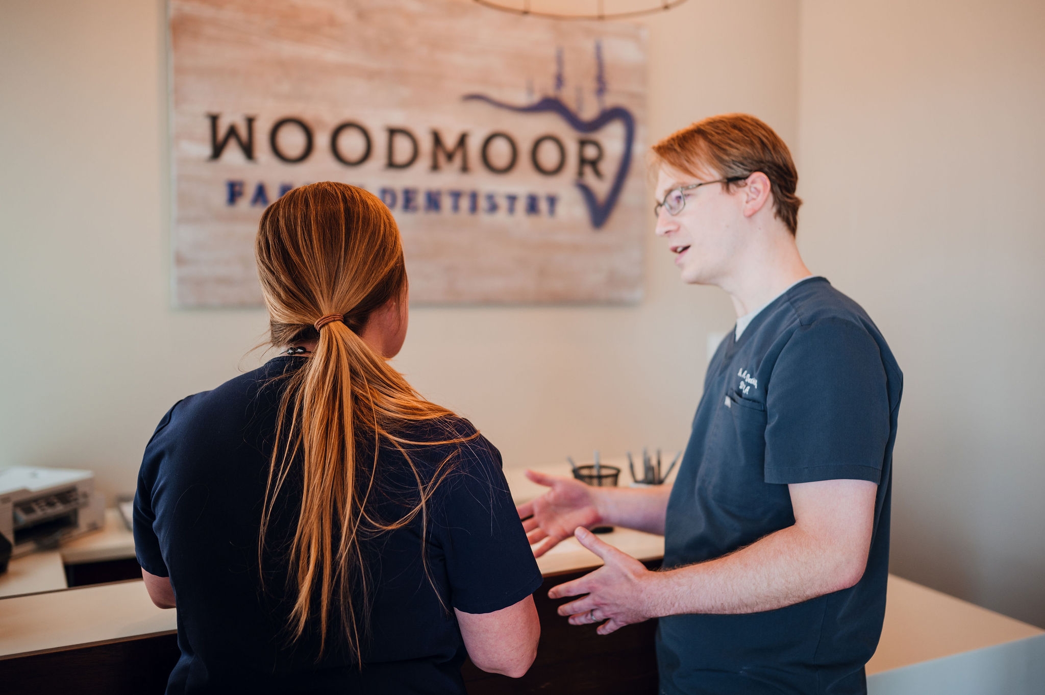 dentist explaining to patient